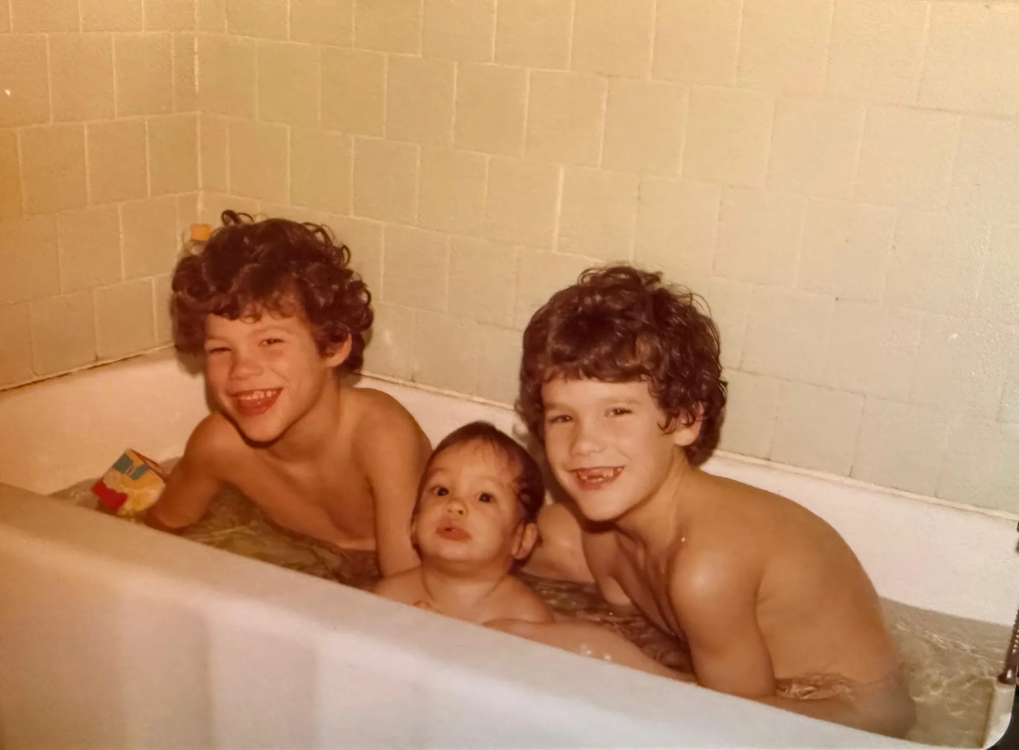 Baby Timmy, looking like he’s struggling to keep his head above water between Greg and me!