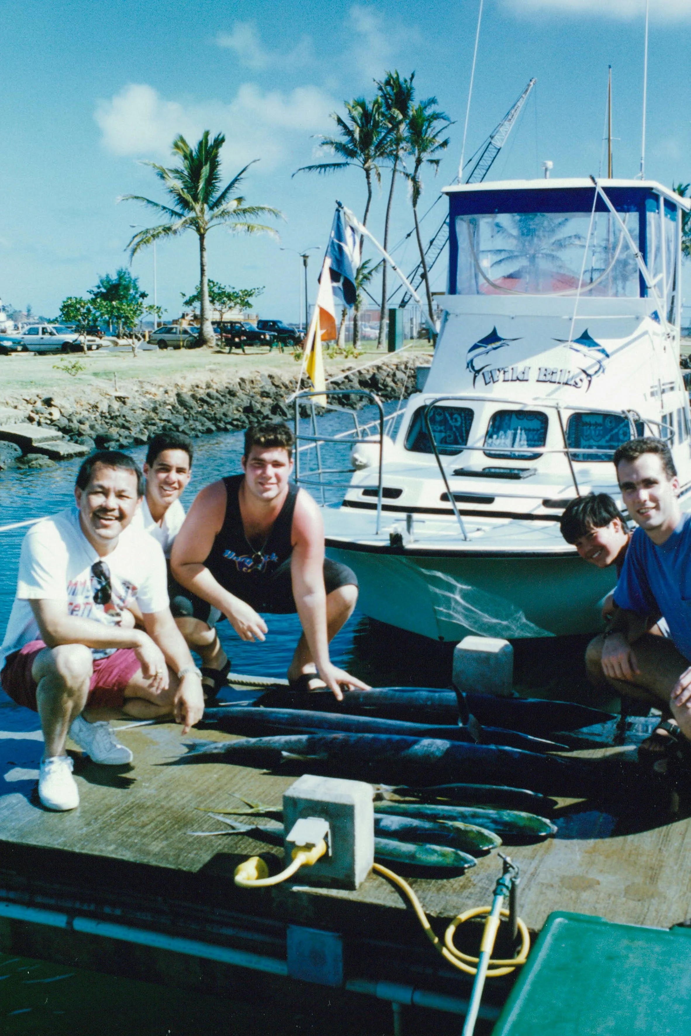 Showing off the catch from a deep-sea fishing trip.